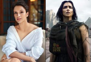 Triptii Dimri and Prabhas in the intense Spirit (2026) movie poster with a fiery cityscape